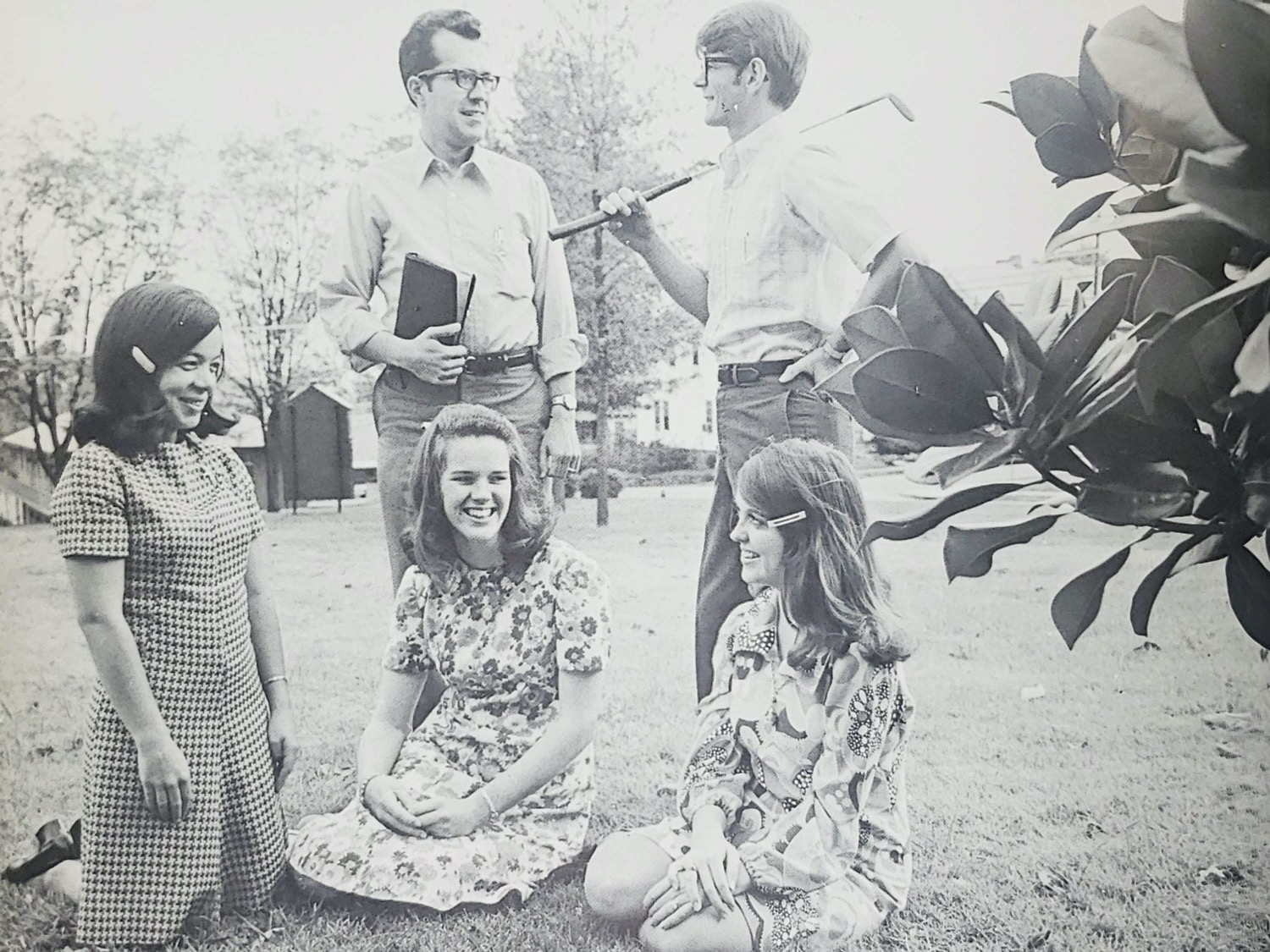 Students sitting in grass talking